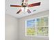 Bright bedroom has a ceiling fan and natural light at 3317 Ridgemill Cir, Dacula, GA 30019
