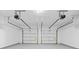 Spacious two-car garage featuring two doors with updated overhead garage door openers, and painted concrete floor at 3317 Ridgemill Cir, Dacula, GA 30019