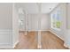Formal dining or living room featuring columns, trim detail, and large window for ample natural light at 3317 Ridgemill Cir, Dacula, GA 30019
