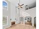 Spacious living room with fireplace, high ceilings, and an open floor plan with natural light at 3317 Ridgemill Cir, Dacula, GA 30019