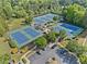 Aerial view showcasing well-maintained tennis courts in a vibrant community, perfect for active residents at 3317 Ridgemill Cir, Dacula, GA 30019