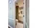 Stylish half bathroom with granite countertops and unique patterned floors at 1004 Westminister Ct, Woodstock, GA 30188