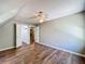 Bedroom showcasing hardwood floors, neutral walls, and open closet at 1004 Westminister Ct, Woodstock, GA 30188