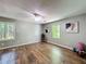Spacious bonus room featuring wood floors, lots of natural light, perfect for multiple uses at 1004 Westminister Ct, Woodstock, GA 30188