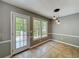 Bright dining area with natural light, neutral colors, and access to the outdoor deck at 1004 Westminister Ct, Woodstock, GA 30188