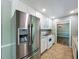 Kitchen showcasing a modern stainless steel refrigerator and tiled floors at 1004 Westminister Ct, Woodstock, GA 30188