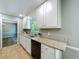 Open kitchen with stainless steel appliances and granite countertops at 1004 Westminister Ct, Woodstock, GA 30188
