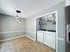 Convenient dining area with laundry closet, shelving and appliances at 1004 Westminister Ct, Woodstock, GA 30188