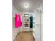 Well-organized walk-in closet with ample shelving and hanging space for clothes and accessories at 1004 Westminister Ct, Woodstock, GA 30188