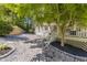 Charming backyard area with a stone patio, perfect for outdoor relaxation and entertaining at 202 Carrington Estates Ct, Woodstock, GA 30188