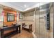 Bathroom featuring an elegant vanity, walk-in shower, and custom finishes at 202 Carrington Estates Ct, Woodstock, GA 30188