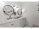 Elegant bathroom with double vanity, marble countertops, and modern fixtures provides a bright and functional space at 202 Carrington Estates Ct, Woodstock, GA 30188