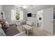 Bright bedroom with a large window, and a well-lit space, adjacent to a small en-suite bathroom at 202 Carrington Estates Ct, Woodstock, GA 30188