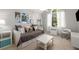 Bright bedroom with ample seating, a large window, and a well-lit space creating a calm atmosphere at 202 Carrington Estates Ct, Woodstock, GA 30188