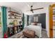 Stylish bedroom featuring a comfortable bed, eclectic decor, and plenty of natural light at 202 Carrington Estates Ct, Woodstock, GA 30188