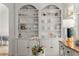 Charming built-in shelving provides ample storage and display space for decorative items and dishware in the dining area at 202 Carrington Estates Ct, Woodstock, GA 30188