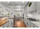 Bright kitchen featuring white cabinets, stainless appliances, granite countertops, and a breakfast nook at 202 Carrington Estates Ct, Woodstock, GA 30188
