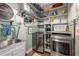 Organized laundry room with shelving, sink, modern washer and dryer, and stylish decor maximizes functionality at 202 Carrington Estates Ct, Woodstock, GA 30188
