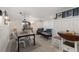 Cozy finished basement area featuring a dining space and living area with modern lighting and decor at 202 Carrington Estates Ct, Woodstock, GA 30188