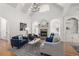 Spacious living room with vaulted ceilings, a brick fireplace, and build in shelves at 202 Carrington Estates Ct, Woodstock, GA 30188