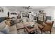 Relaxing living room area with a large sofa, ceiling fan, beverage bar, and eclectic decor at 202 Carrington Estates Ct, Woodstock, GA 30188