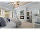 Bright and airy main bedroom features a fireplace, large windows, and ensuite bathroom for ultimate comfort at 202 Carrington Estates Ct, Woodstock, GA 30188