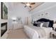 Spacious main bedroom with a fireplace, vaulted ceiling, and stylish decor offers a relaxing retreat at 202 Carrington Estates Ct, Woodstock, GA 30188