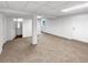Finished basement area with carpet and an adjacent bathroom at 2390 Century Ln, Snellville, GA 30039