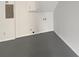 Finished basement area with concrete floor, white walls, and utility hook-ups at 2390 Century Ln, Snellville, GA 30039