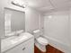 This bathroom has a single sink vanity with a large mirror and a shower-tub combo at 2390 Century Ln, Snellville, GA 30039