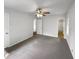 Bedroom features neutral tones, a ceiling fan, and attached bathroom at 2390 Century Ln, Snellville, GA 30039