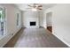 Bright living room features neutral tones, a fireplace, and fresh carpet at 2390 Century Ln, Snellville, GA 30039