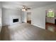 Living room features neutral tones, a fireplace, and access to the kitchen at 2390 Century Ln, Snellville, GA 30039