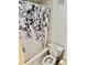 Bathroom featuring a bathtub with floral shower curtain and standard toilet at 2479 Ne Peachtree Ne Rd # 1112, Atlanta, GA 30305