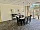 Well-lit dining area featuring a modern table and stylish seating next to outdoor patio at 2479 Ne Peachtree Ne Rd # 1112, Atlanta, GA 30305
