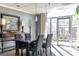 Dining room with modern table set, console table with lamps, and bright window at 2479 Ne Peachtree Ne Rd # 1112, Atlanta, GA 30305