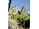 Building exterior showcasing city views with trees between luxury buildings at 2479 Ne Peachtree Ne Rd # 1112, Atlanta, GA 30305
