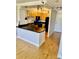 A kitchen with an island bar, stainless steel sink, and modern appliances at 2479 Ne Peachtree Ne Rd # 1112, Atlanta, GA 30305