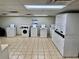 Clean laundry room featuring multiple high-efficiency washers and dryers at 2479 Ne Peachtree Ne Rd # 1112, Atlanta, GA 30305