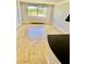 Bright living room with hardwood floors and large window offering nice city views at 2479 Ne Peachtree Ne Rd # 1112, Atlanta, GA 30305