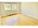 Sunlit living room with hardwood floors and a large window offering views of the surrounding landscape at 2479 Ne Peachtree Ne Rd # 1112, Atlanta, GA 30305