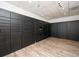 Secured package room with black lockers and light wood-look floors at 2479 Ne Peachtree Ne Rd # 1112, Atlanta, GA 30305