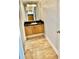 Stylish powder room featuring wood floors, sleek countertop, mirror and modern light fixture at 2479 Ne Peachtree Ne Rd # 1112, Atlanta, GA 30305