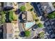 Aerial view of the community pool and clubhouse nestled among mature trees and manicured lawns at 3365 Vintage Se Cir, Smyrna, GA 30080