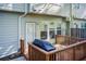 A wooden back deck with a grill and convenient access to the home's exterior at 3365 Vintage Se Cir, Smyrna, GA 30080