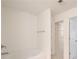 Well-lit bathroom featuring a tub with a shower and a doorway to a walk-in closet with shelving at 3365 Vintage Se Cir, Smyrna, GA 30080