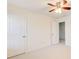 Well-lit bedroom with neutral carpet and an open doorway leading to an adjoining bathroom at 3365 Vintage Se Cir, Smyrna, GA 30080