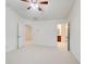 Spacious bedroom featuring a ceiling fan and white carpet with an open doorway to an adjoining bathroom at 3365 Vintage Se Cir, Smyrna, GA 30080