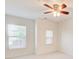 Bright bedroom featuring a ceiling fan and natural light streaming through two windows at 3365 Vintage Se Cir, Smyrna, GA 30080