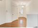 Inviting foyer with hardwood floors, white walls, and natural light from the front door at 3365 Vintage Se Cir, Smyrna, GA 30080